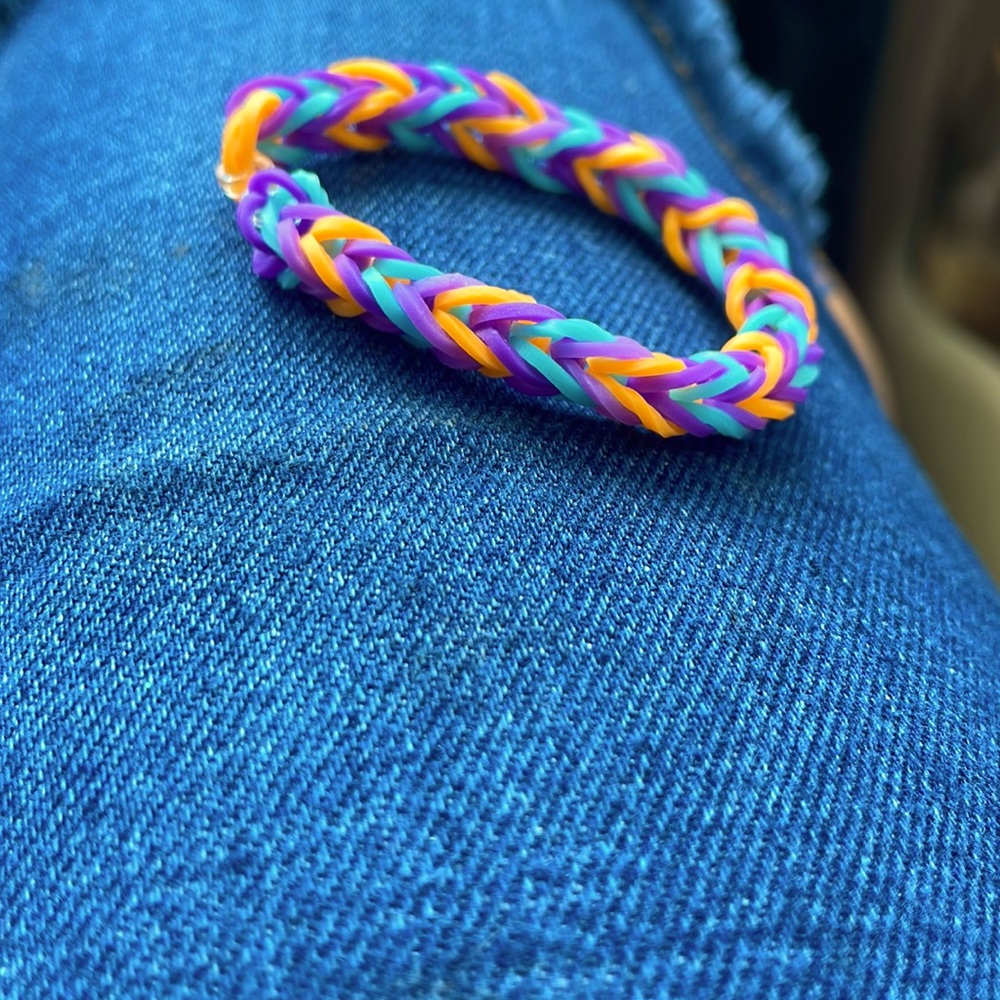 Homemade bracelets.The brand is crazy loom.The colors are blue,purple,purple.